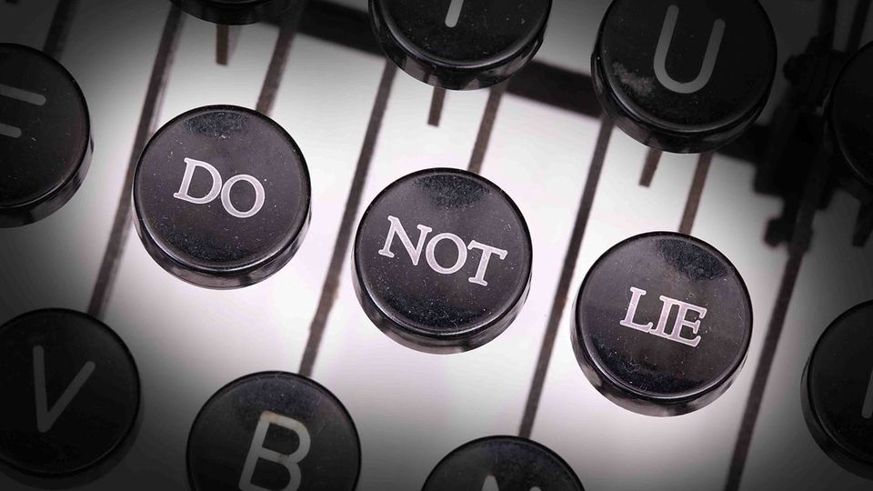 Three old-school typewriter keys altered to read DO NOT LIE