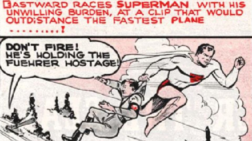 Comics panel shows Superman holding Adolf Hitler by the collar; beneath, soldiers shout, 'Don't fire! He's holding the Fuehrer hostage!'