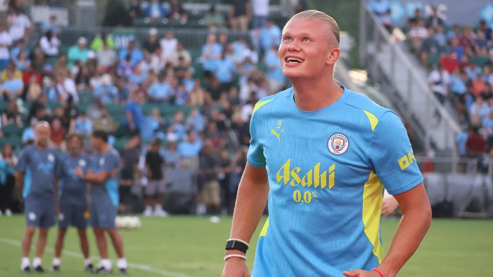 Erling Braut Haaland looking upward with a happy, mildly goofy expression at Man City's opening practice for the FC Series in Cary, North Carolina