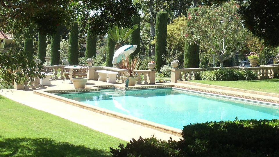 Beverly Hills swimming pool of the Virginia Robinson Estate on a glorious sunny California day
