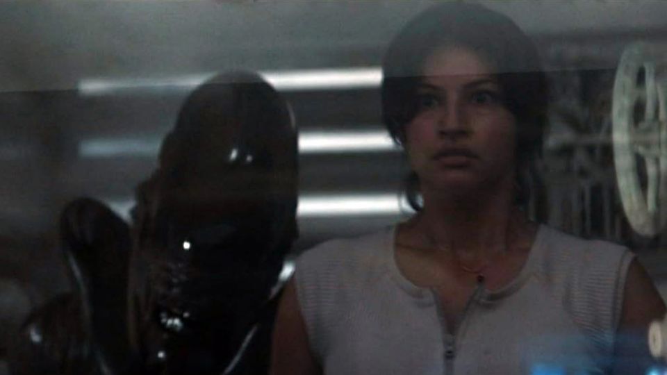 Near the end: Richa Moorjani as Captain Zoya Zaveri in ALIEN: Earth with a Xenomorph behind her