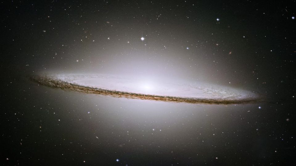 "Looking like a broad-brimmed Mexican hat, the “Sombrero” Galaxy, M104, is a spiral galaxy seen nearly edge-on. The center of M104 is thought to be home to a massive black hole."
