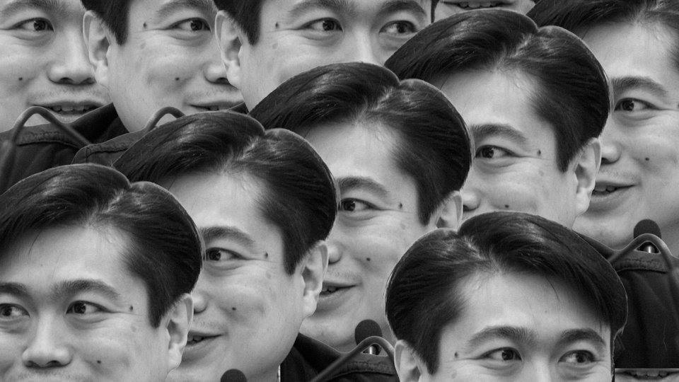 Black & white photo of Joi Ito multiplied so that there are all of these smiling Joi Itos, so many, matching all his connections. 
