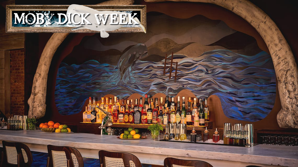 Quick Eternity, a (gently) Moby-Dick-themed cocktail bar and restaurant. White marble bar, rattan-backed stools, giant whalebone-looking things framing a painting of a fierce whale