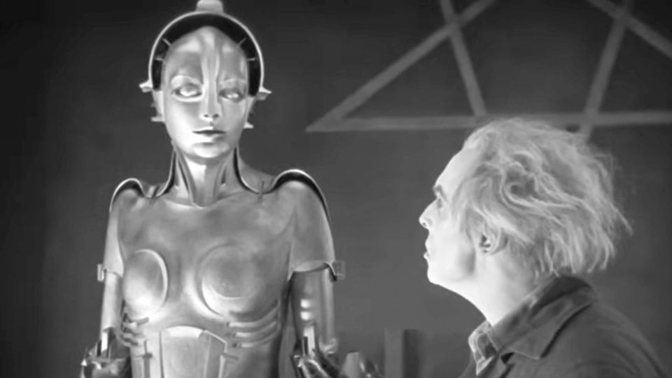 A silvery robot may or may not be willing to obey the wishes of its wild-haired inventor