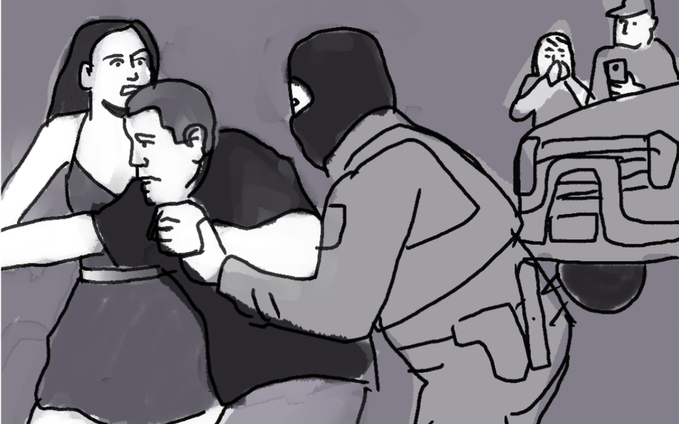Hooded man in paramilitary gear struggles to overcome man in black t-shirt; woman behind him, scared, helping the man in t-shirt