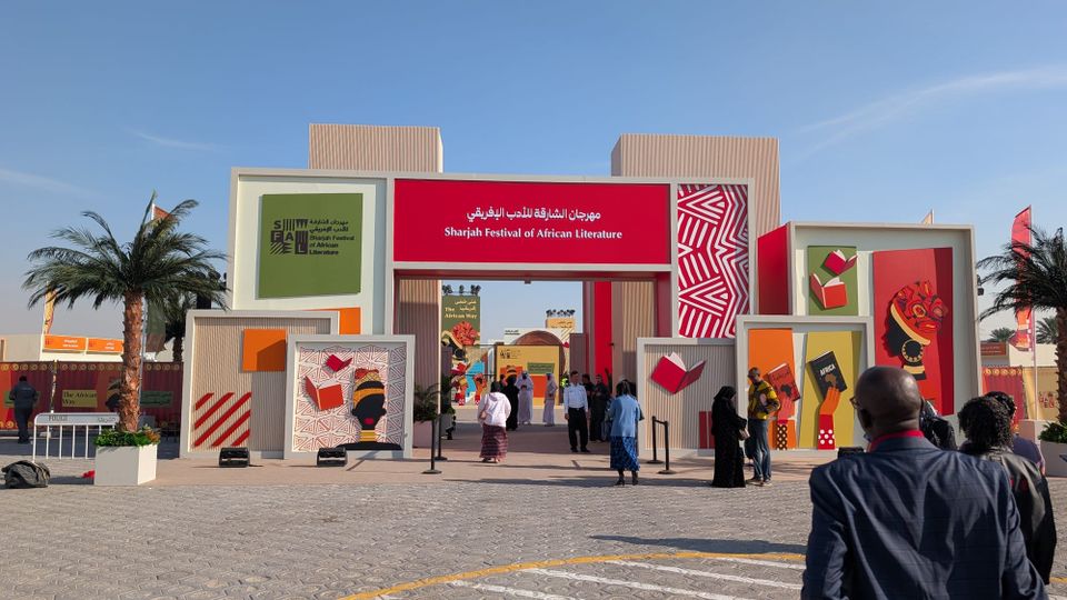 Brightly colored doorway of the Sharjah Festival of African Literature, Sharjah, outdoors before a clear blue sky