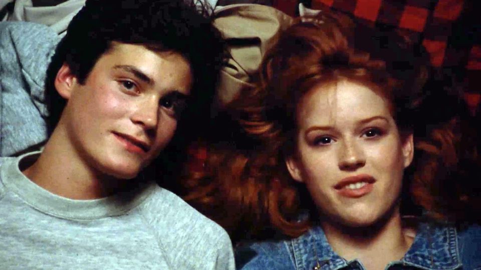 Teen stars on a romantic camping weekend, lying down and looking up at the sky