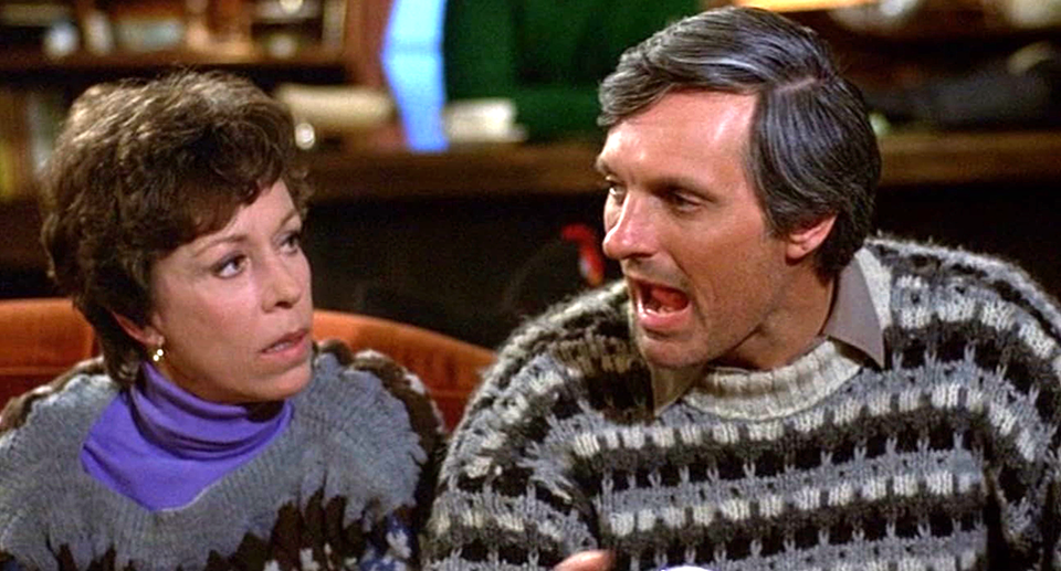 Carol is looking at Alan blabbering and his mouth is open real big