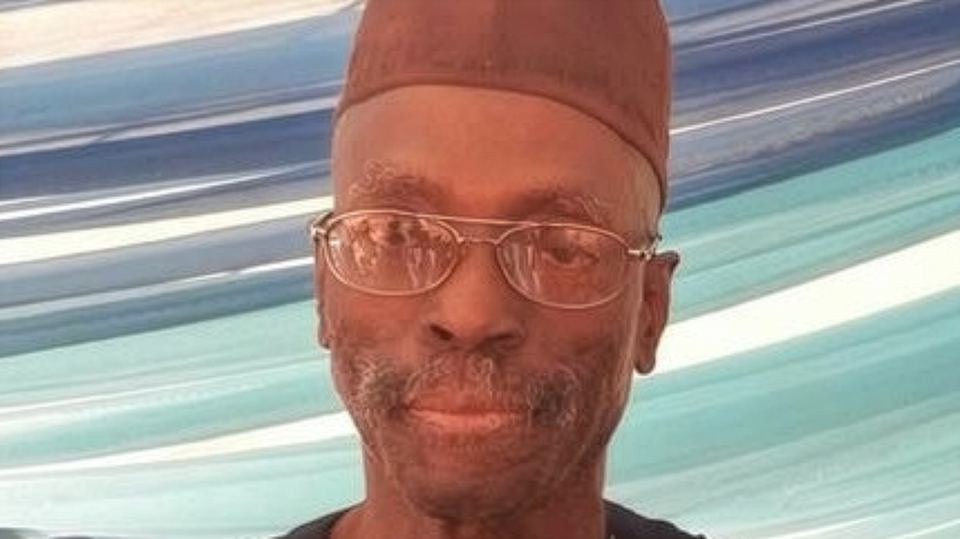The scholar Biodun Jeyifo, bespectacled and in a cloth cap