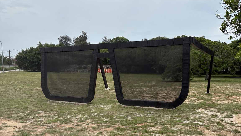 On a grassy lot a sculpture of thick-framed glasses approximately 6' tall. All photos by the author.
