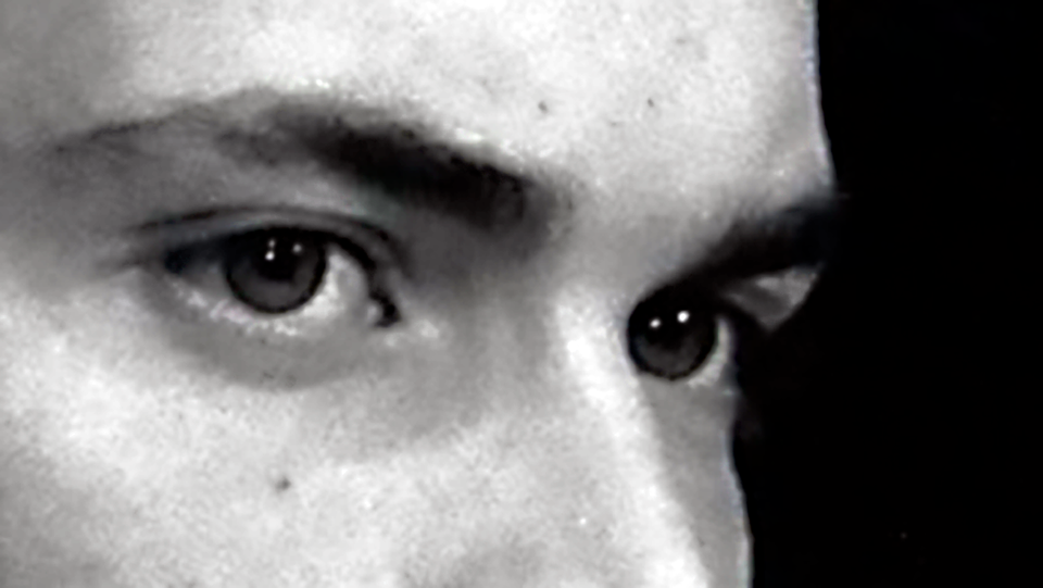 Movie still cropped close around the scowling eyes of Randall Batinkoff.