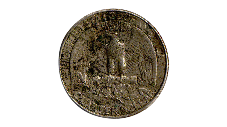 The "tails" side of a grimy old 25-cent piece
