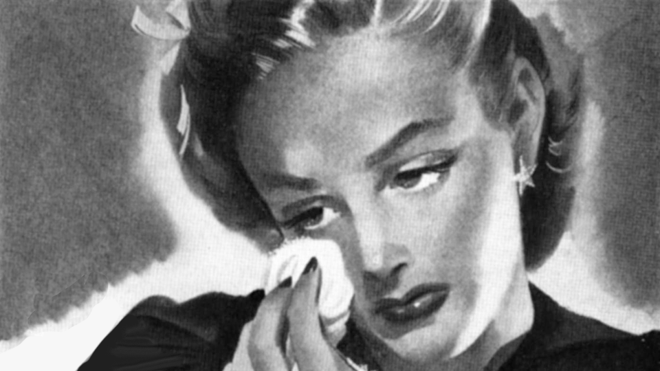 A vintage trad lady dabbing tears from her eyes