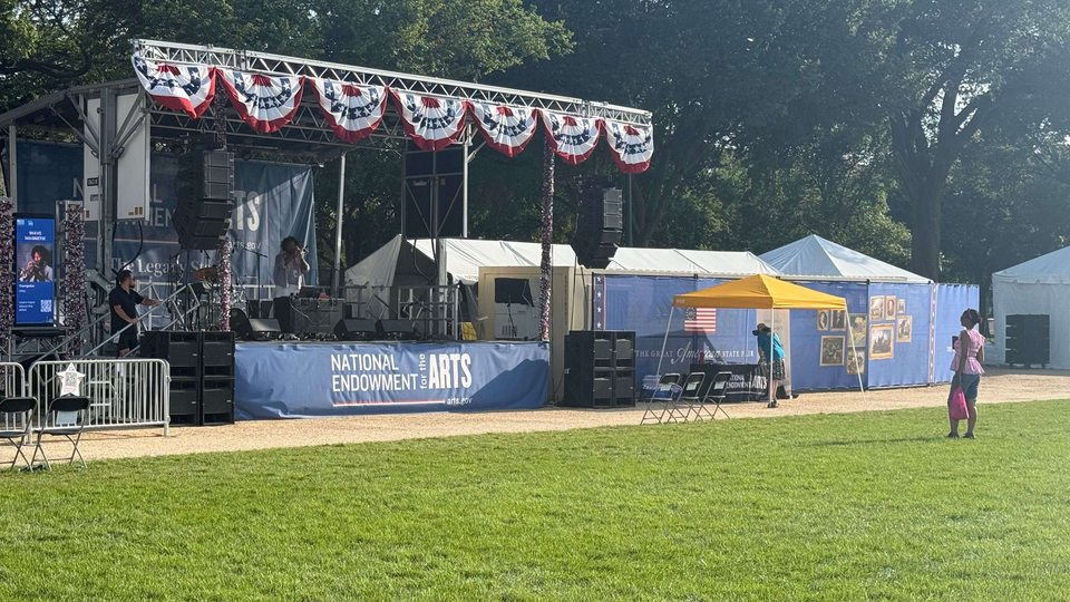 "The National Endowment for the Arts stage has a solo performer up there right now."