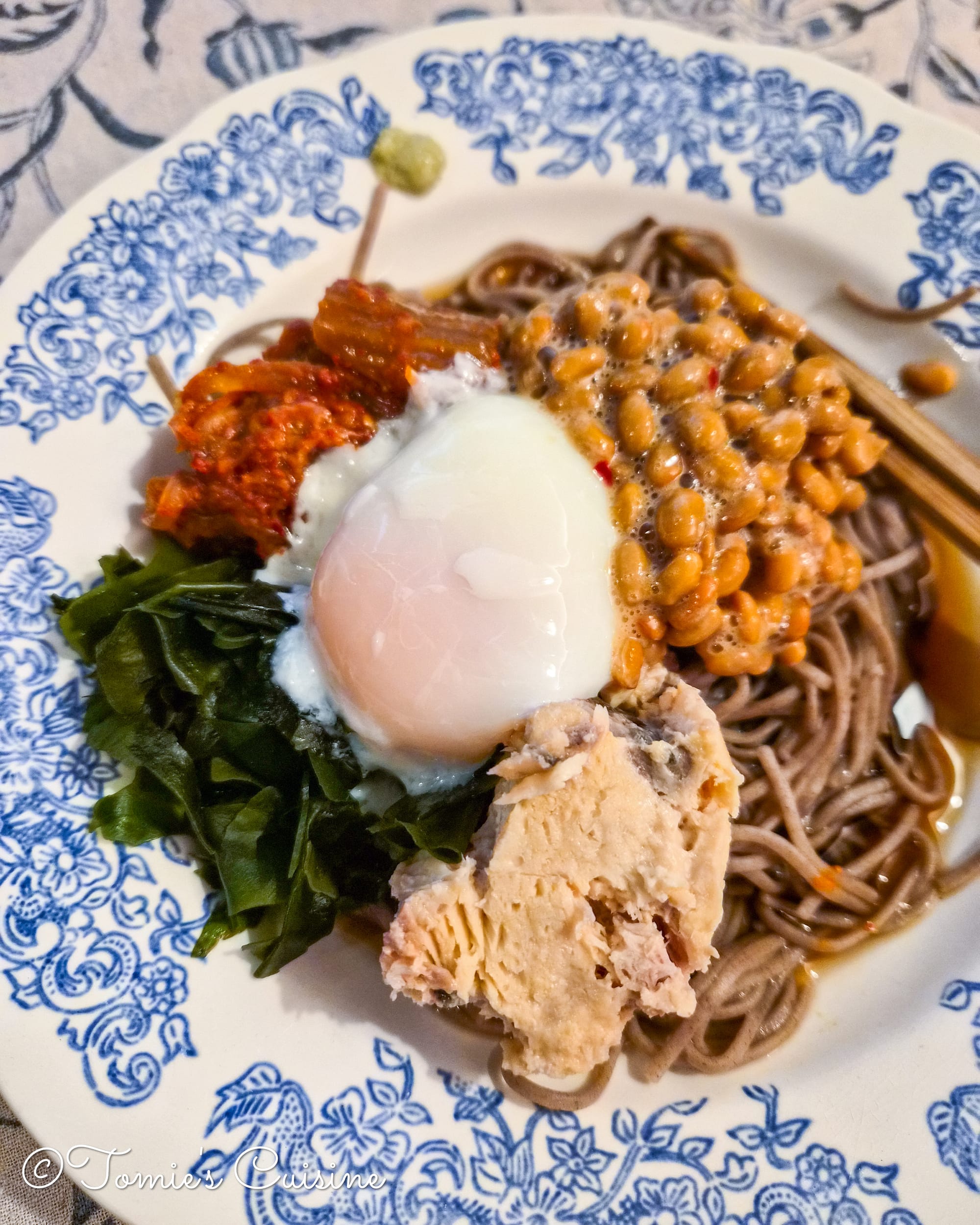 This dish was made with whatever we had in our kitchen that day, including natto (fermented soybeans), kimchi, wakame seaweed, tinned salmon, and onsen tamago (slow-cooked egg).