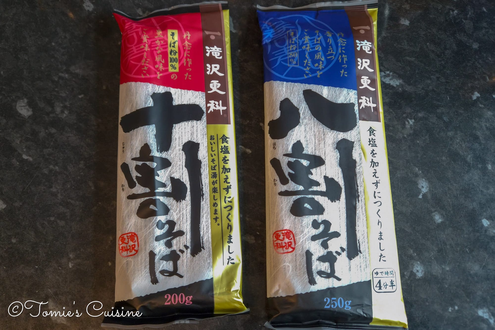 The red package is Juwari (100% buckwheat) soba, and the blue one is Nihachi soba. (Although it's written Hachiwari in the package, both mean made from 80% buckwheat and 20% wheat flour.)
