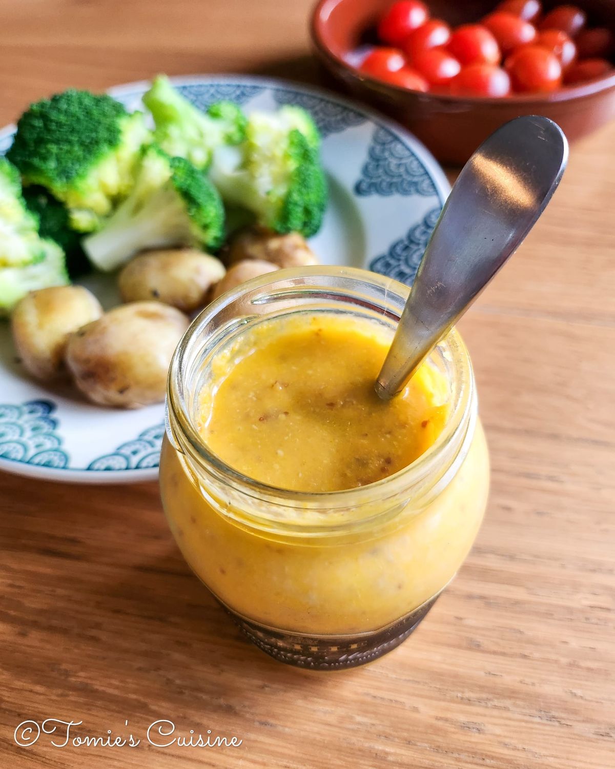 Carrot dressing with whole grain mustard. Fresh tomato, steamed broccoli, and new potatoes on the side.