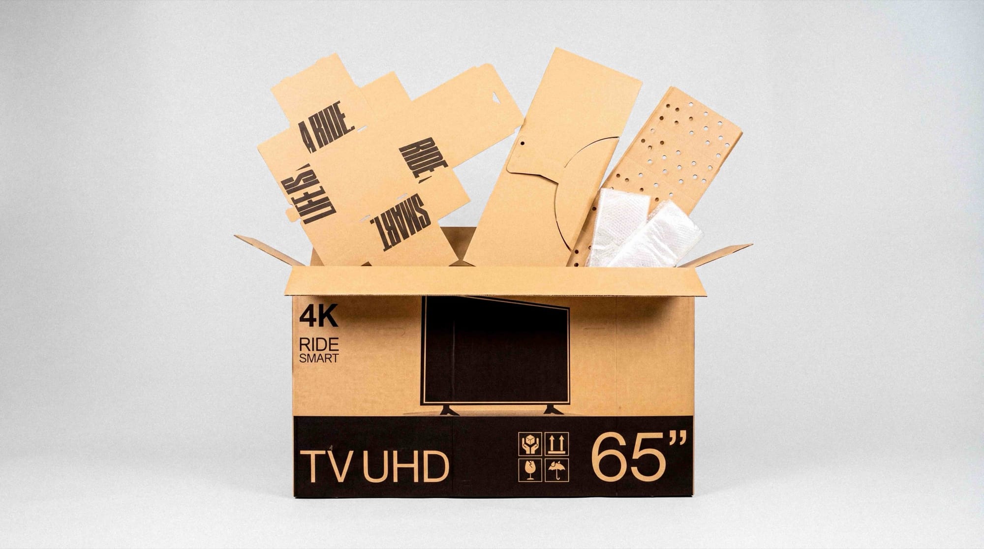 An open buycycle shipping box with protective cardboard inserts and bubble wrap