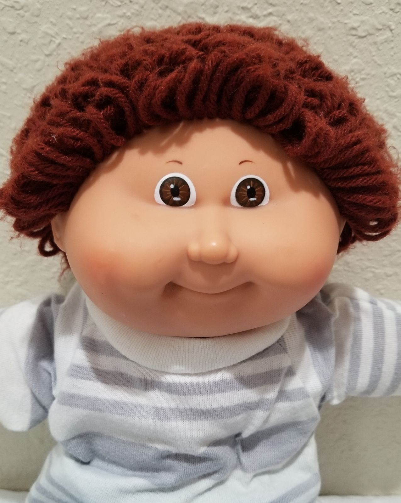 This Cabbage Patch Kids boy doll is dressed and ready to play! Needs repair on his rump. Brown ...