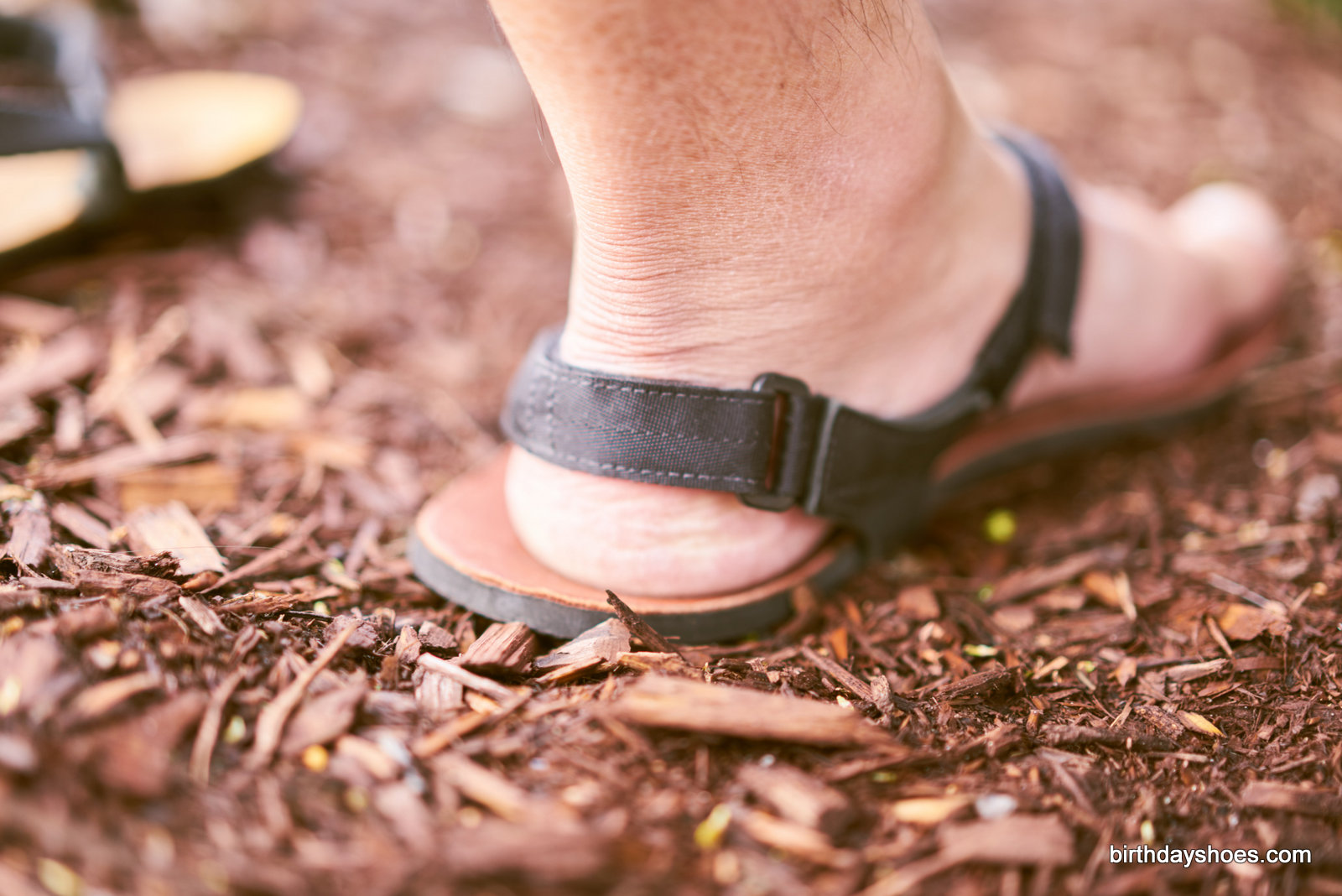 The new heel strap features a velcro adjustment for unparalleled, customized security when running or hiking