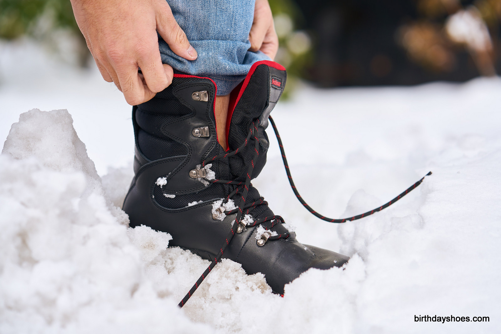 The high-slung tongue starts about 2/3 of the way up the boot; higher than a standard boot for added protection from puddles and snowbanks