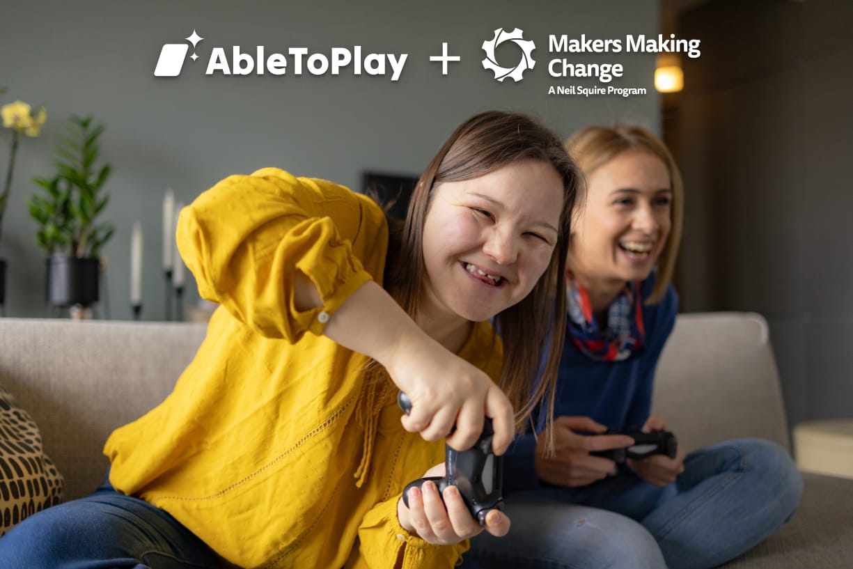 An image of two people playing video games, one in a yellow shirt and one in a blur shirt, in a beige room. The logos of AbleToPlay and Makers Making Change appear..