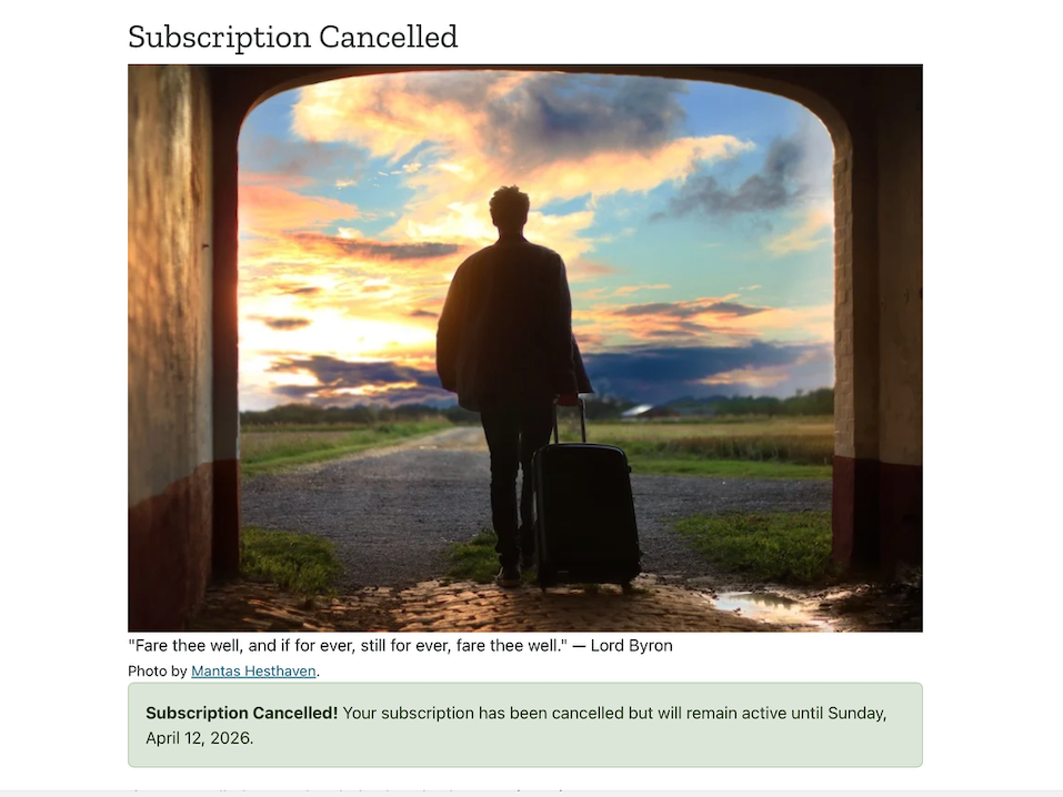 A man in silhouette pulling a suitcase walks through in arch facing an open road and a beautiful sunrise.