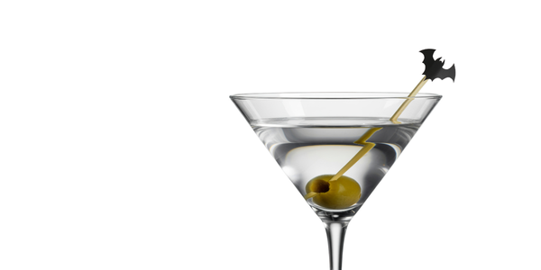 A closeup of a martini. The olive has a cocktail pick with a bat at the top.