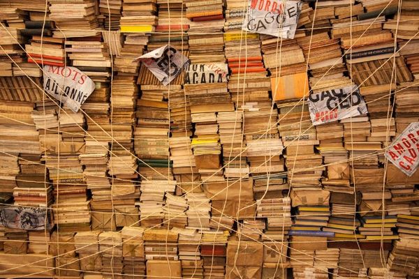 Huge stacked pile of books and papers