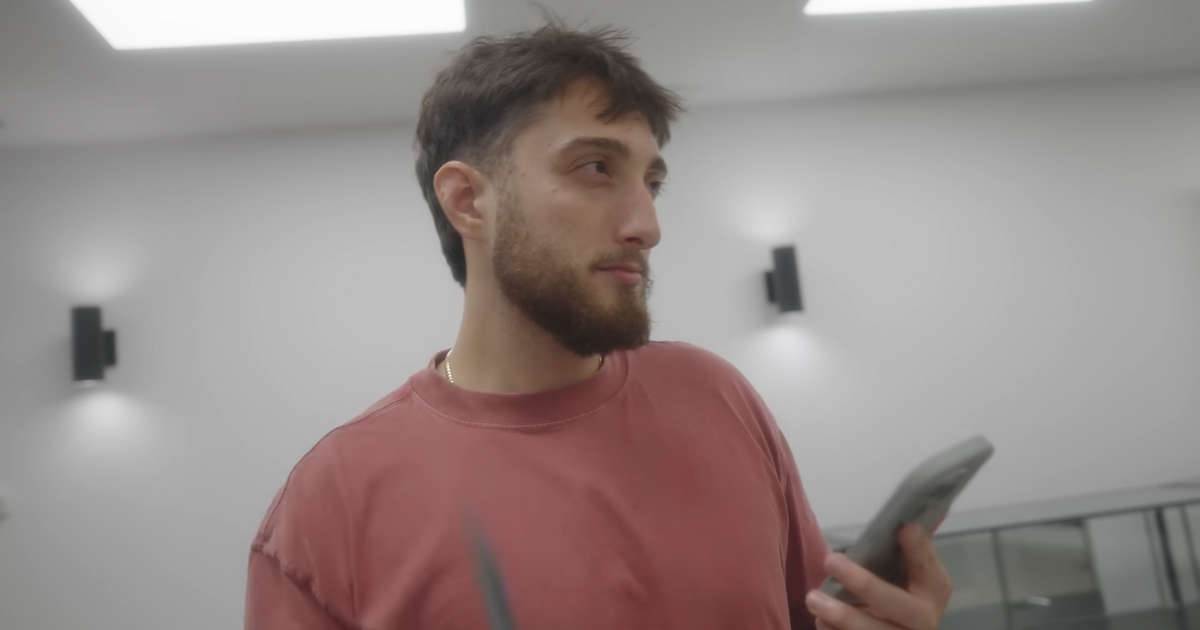 Vookum wearing red shirt