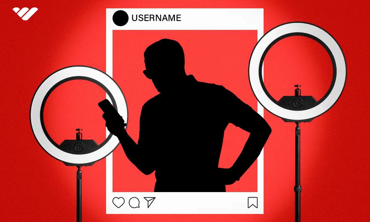 Person holding phone standing next to ring lights