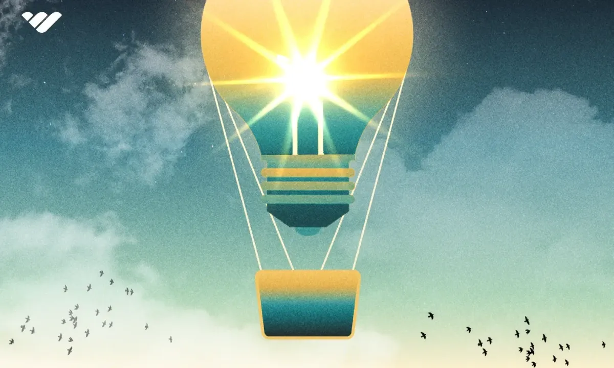 Lightbulb ballon in the sky with birds