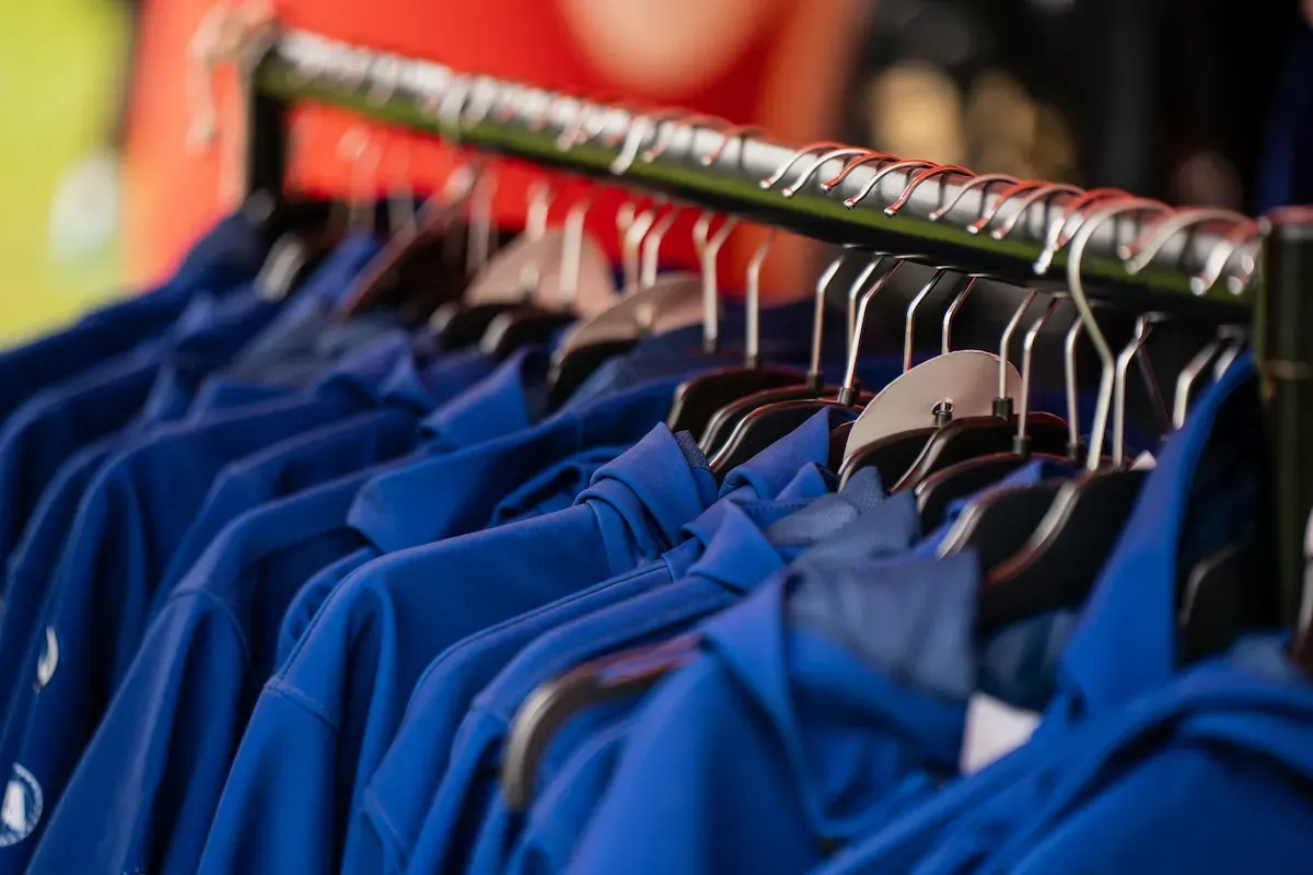 Blue hoodies on a clothing rail