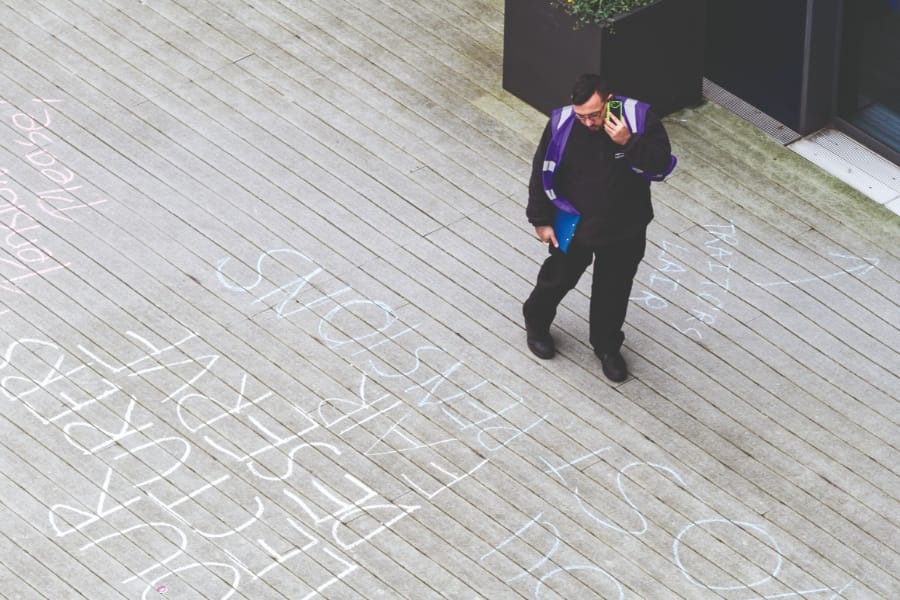 A security guard checks out the messages of support // Joseph O'Connell-Danes