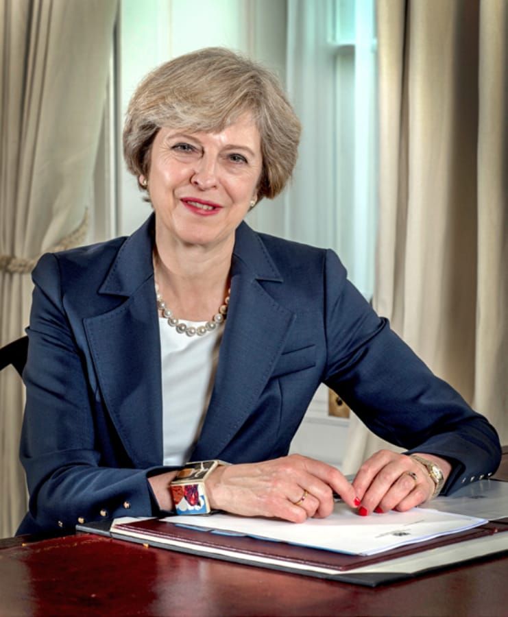 Theresa May announces tuition fee review