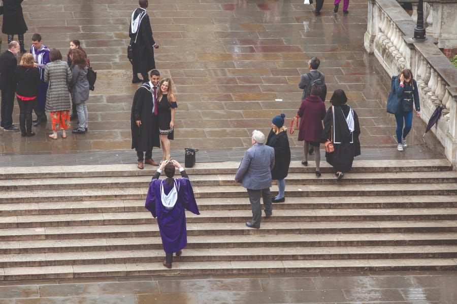 Poor weather doesn't dampen spirits at postgraduate graduation ceremony