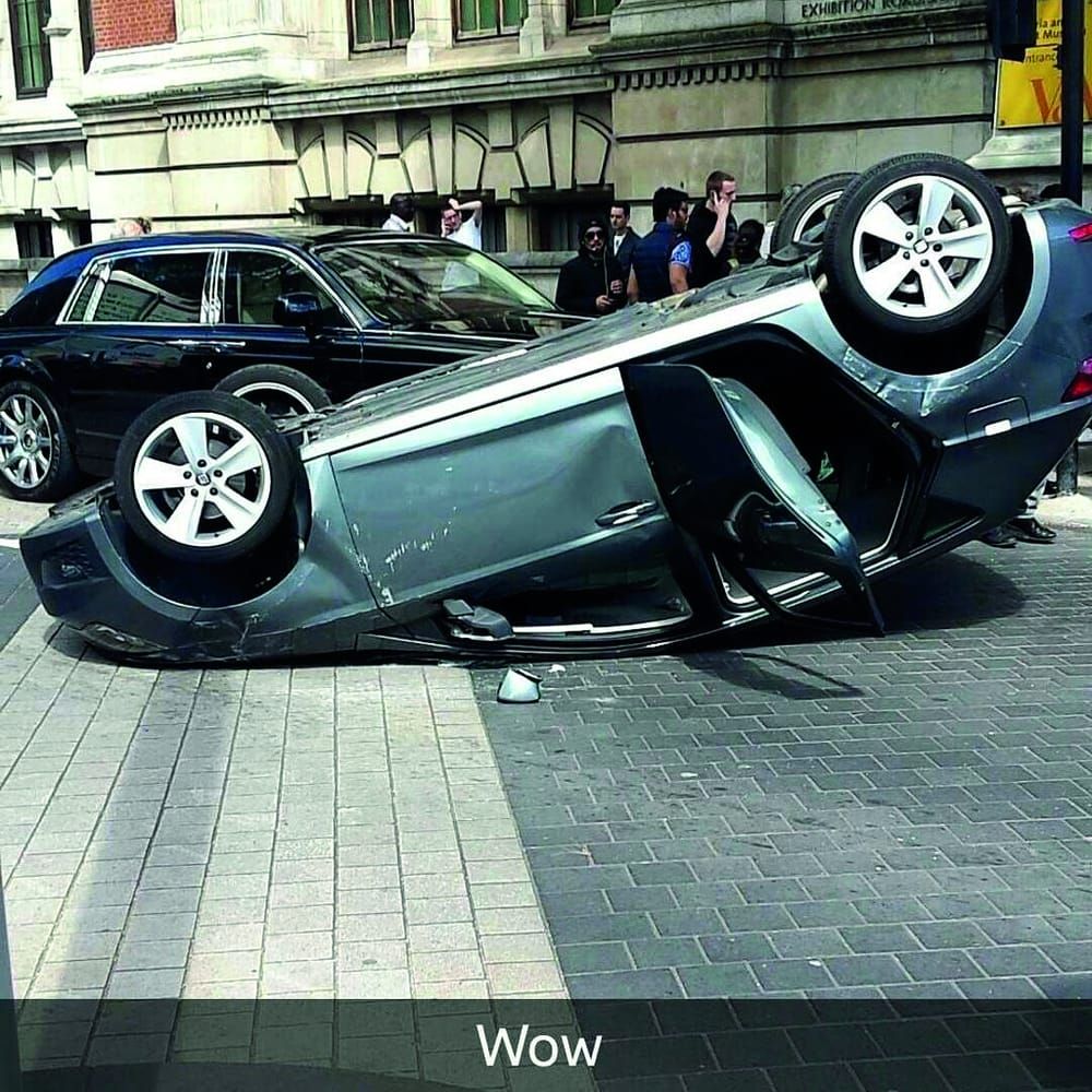 Car flipped over on Exhibition Road, two injured
