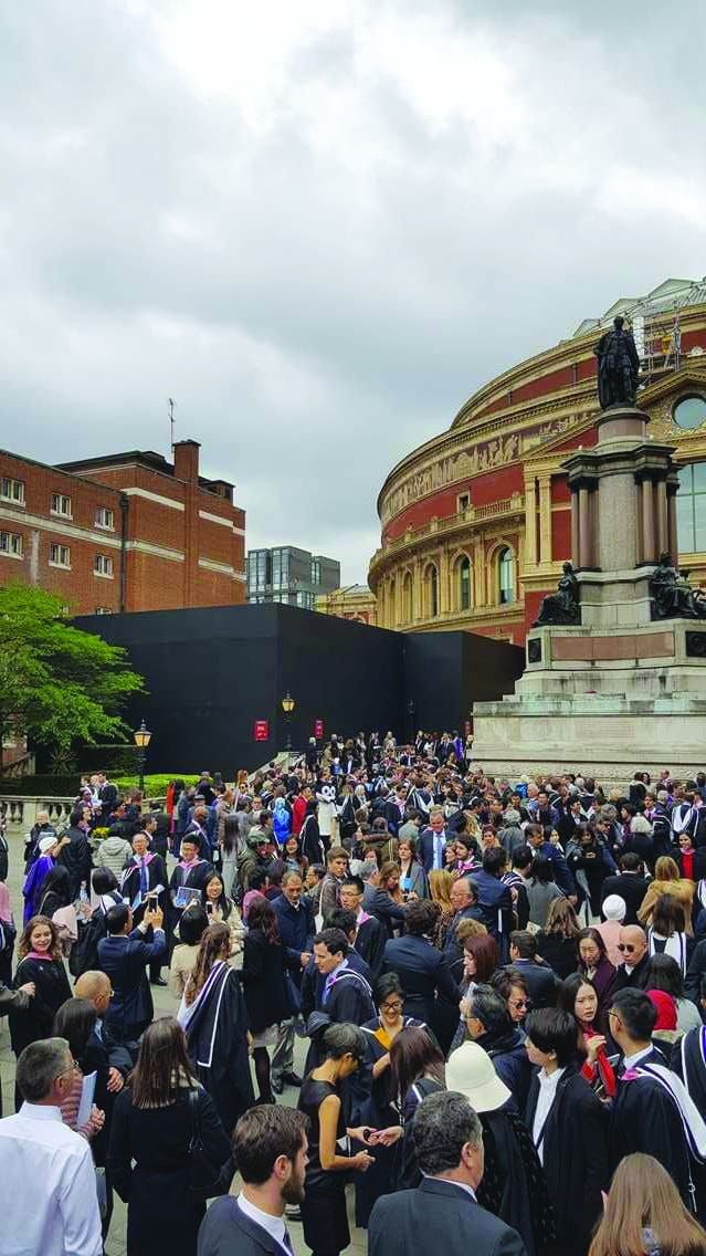 Relieved postgrads finally graduate