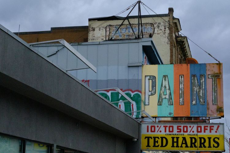 For many Vancouverites this is an iconic sign, slowly disintegrating on a rainy Spring morning; Downtown East Side, Vancouver