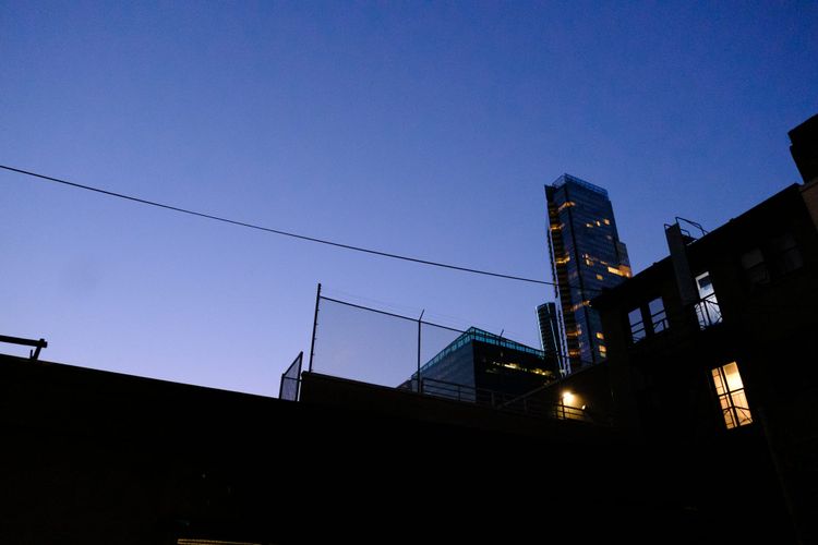 Behind the fashion stores on Robson Street, looking northwest from Rosemary Brown Lane; Downtown Vancouver