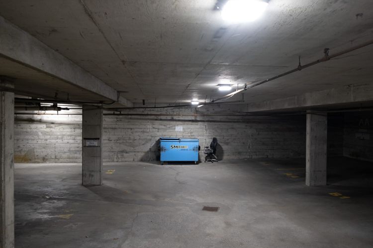 An empty parkade, night