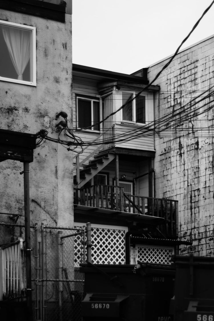 Behind apartments and commercial space; Kingsway, Vancouver