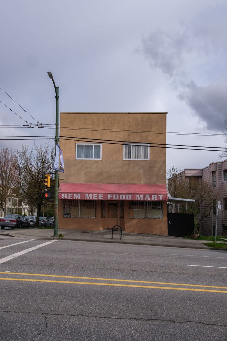 House over grocery store; East Broadway, Vancouver