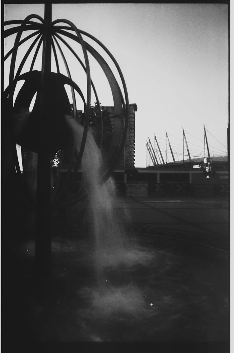 Queen Elizabeth Theatre Plaza fountain, with BC Place in the background, looking east; Vancouver