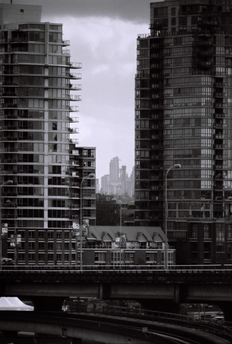 Looking east from Dunsmuir Viaduct between the towers of Main St. to the towers in Metrotown, Burnaby