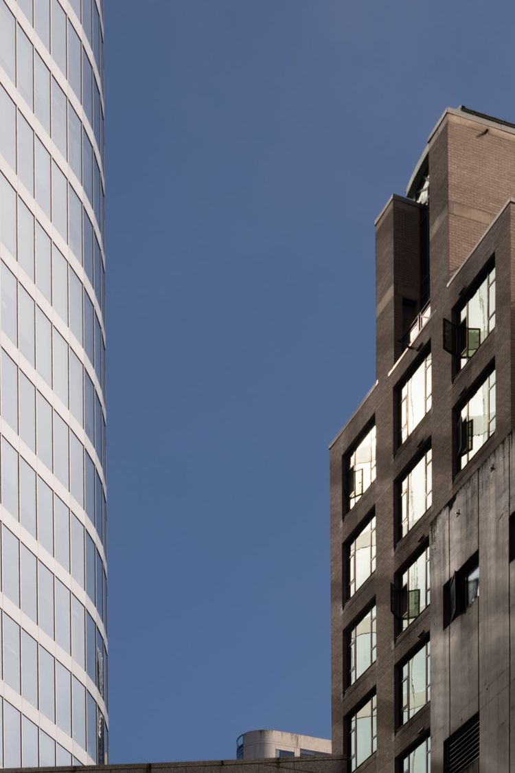 Old and new buildings reflecting light