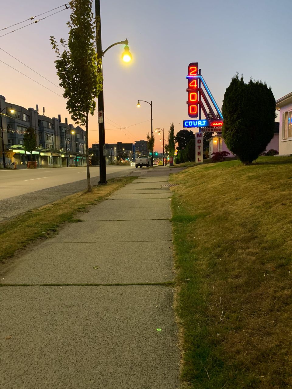 Looking east at the rising sun on Kingsway; Vancouver