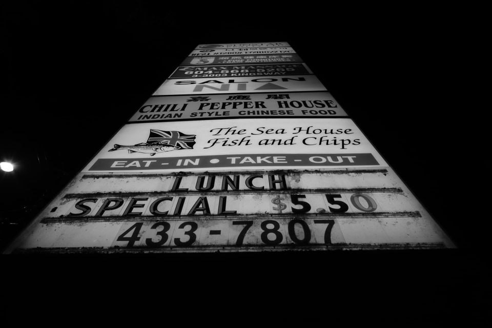 Lighted sign, morning; Kingsway, Vancouver