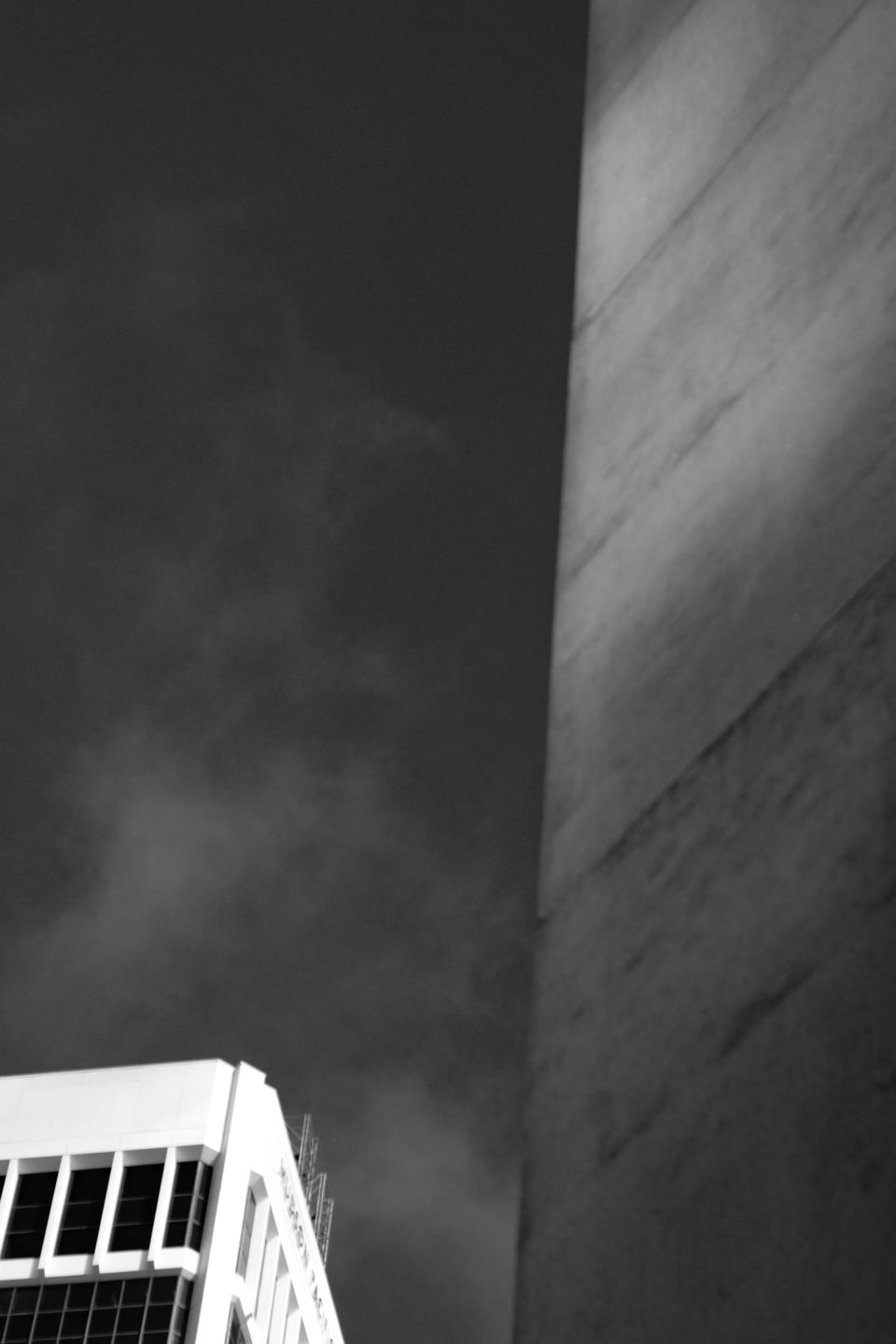 Looking up between a Brutalist giant and an Internationalist premium office tower; both late 70s.